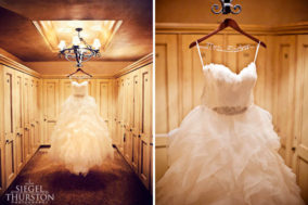 beautiful strapless wedding dress with feathers hanging from chandelier