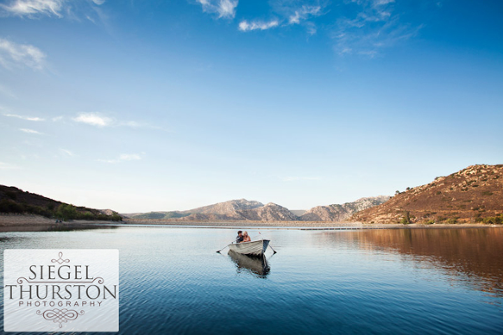 romantic notebook inspired photos of a couple in a row boat for their engagement photoshoot