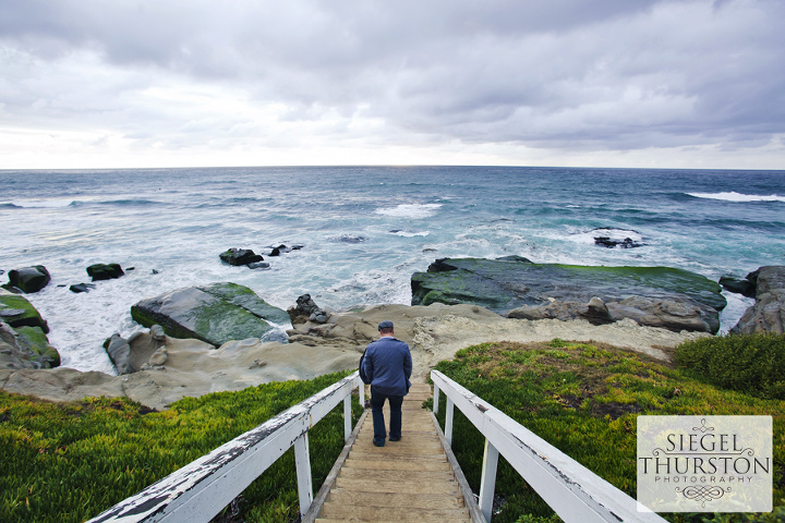 walking down the steps to windansea beach on a stormy day