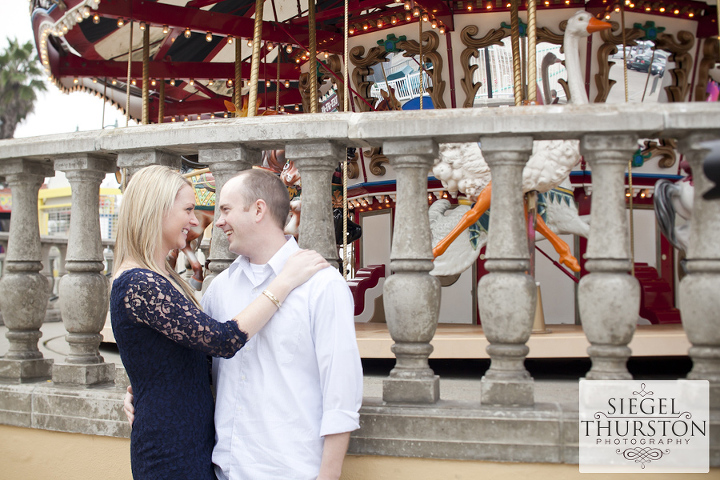 engagement photos at the mission beach carousel
