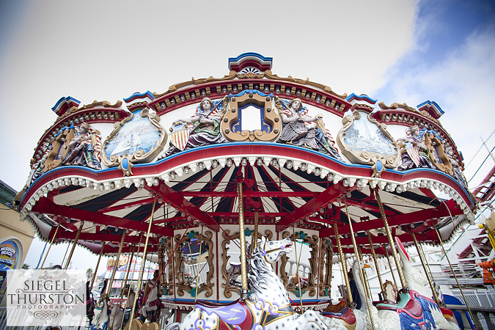 engagement photos at the mission beach carousel