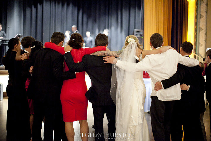 family dancing at wedding reception