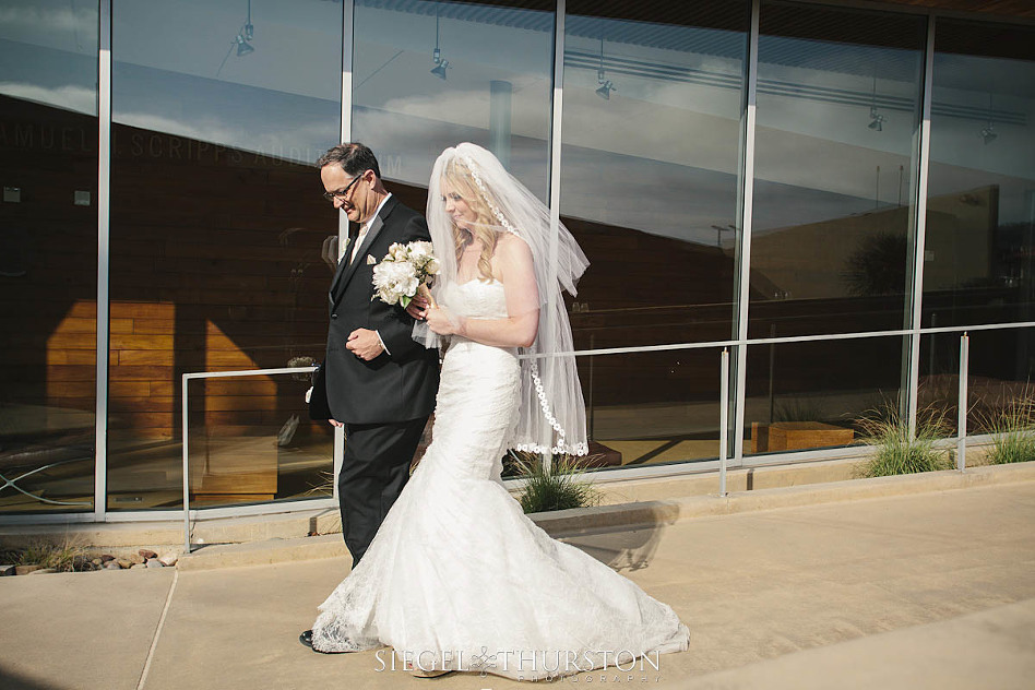 emotional father walking her daughter down the aisle