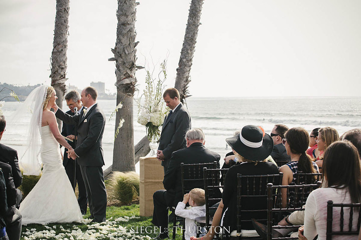 sweet moment between a groom and his bride during their wedding ceremony