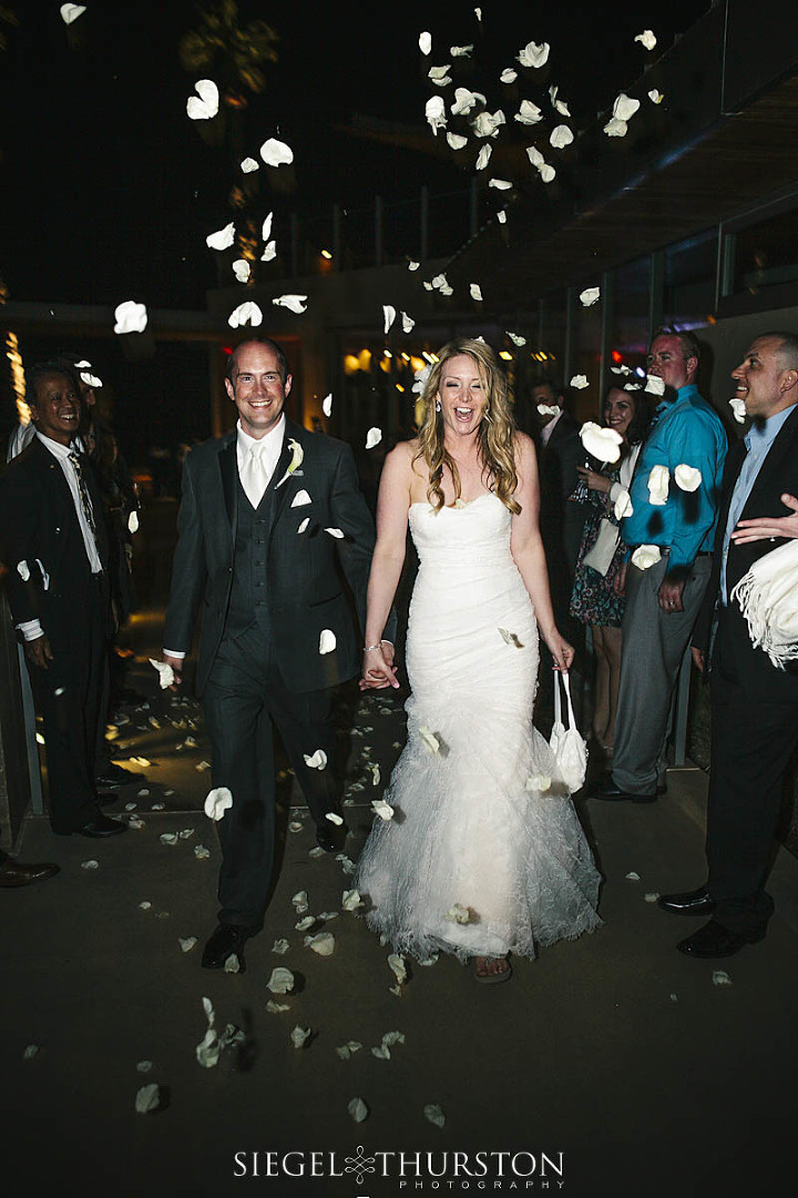 Rose petals make for a wonderful send-off for the bride and groom