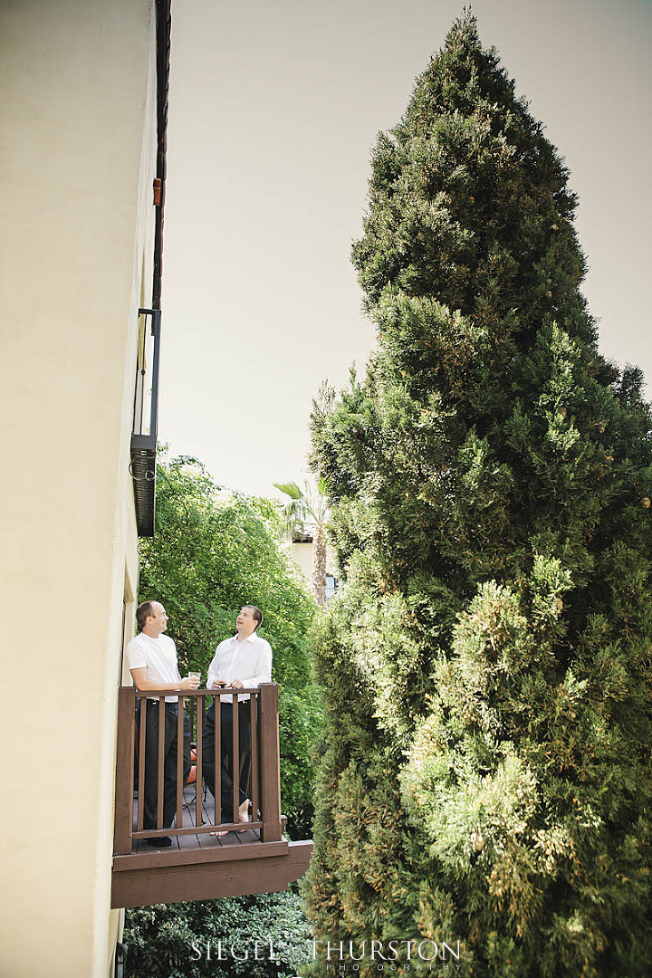 groom having a beer with his best man before wedding ceremony