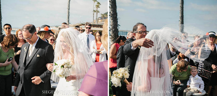 father giving the bride away at beach wedding