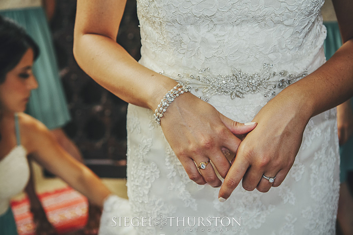 lace wedding dress and beaded silver belt