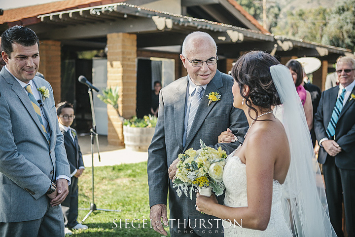 father giving away his daughter at her wedding