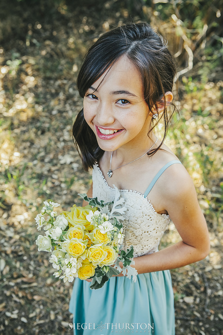 flower girl in a lace and mint dress