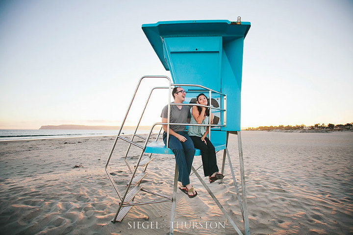 beach portraits with a life guard tower on the coronado beach in san diego