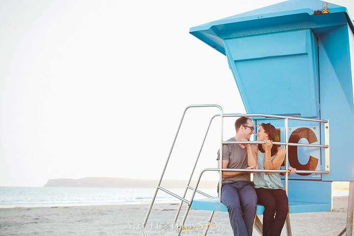 beach portraits with a life guard tower on the coronado beach in san diego