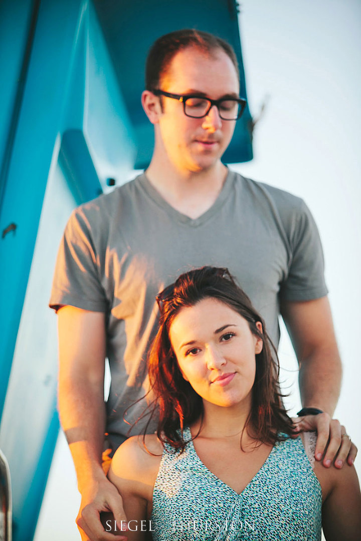 beach portraits with a life guard tower on the coronado beach in san diego