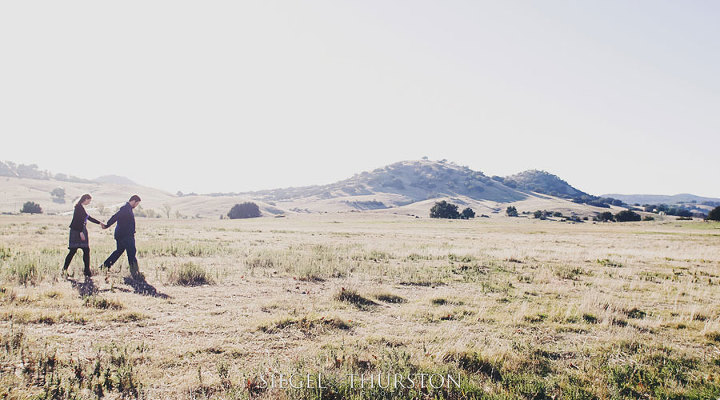 engagement pictures in grassy fields in San Diego
