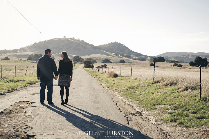 cute Julian california engagement photos down an old farm road