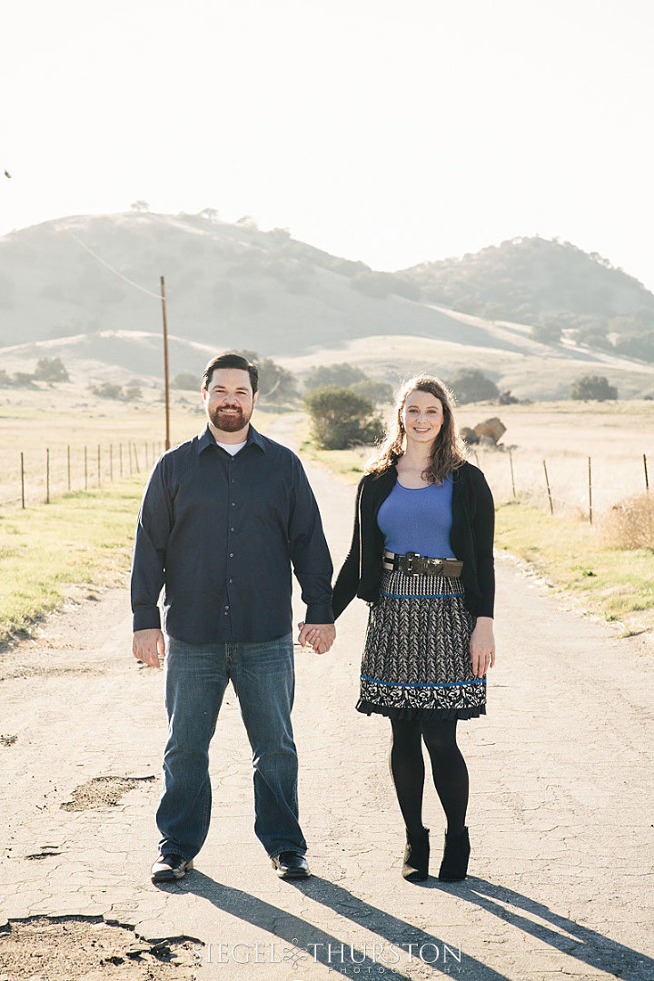 cute Julian california engagement photos down an old farm road