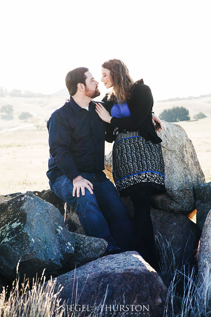 cute Julian california engagement photos in an open field