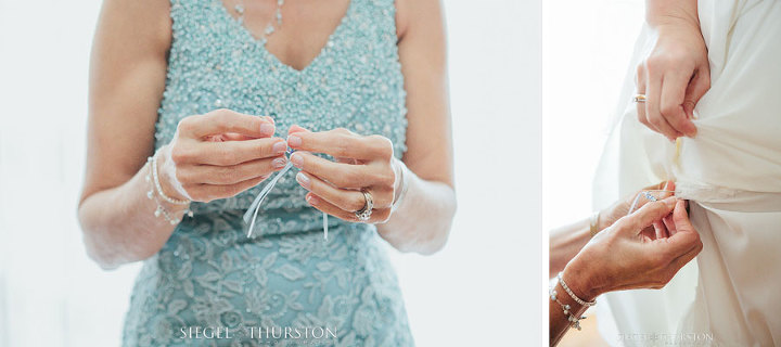 mother of the bride pinning something blue into her daughter