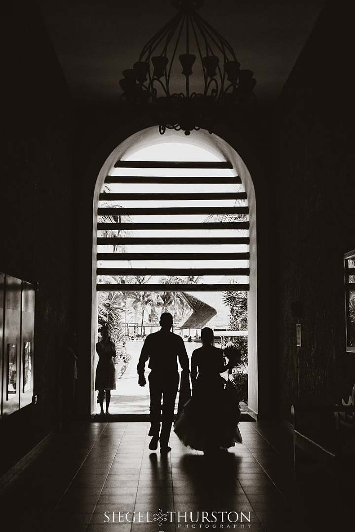 father of the bride walking his little girl to her wedding ceremony