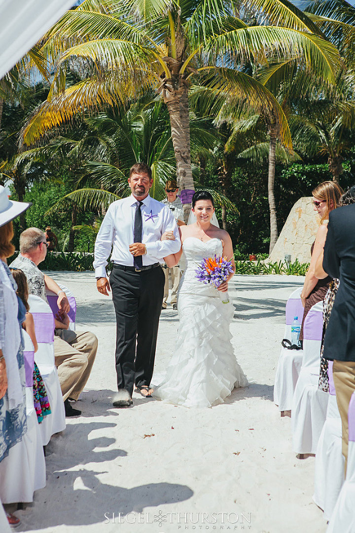 tropical destination wedding bride walking down the aisle