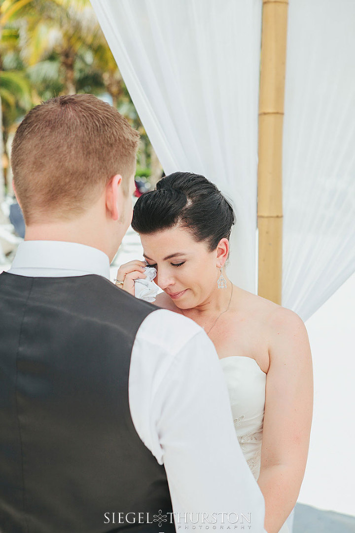 beach wedding emotional photo of the bride crying at the ceremony