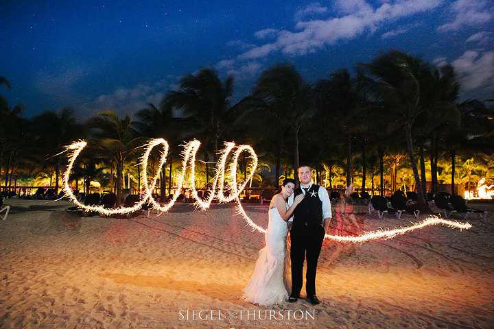fun sparkler beach wedding photos