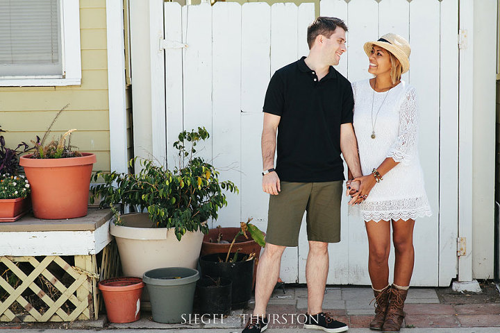 mission beach engagement photos in front of vintage san diego bungalows