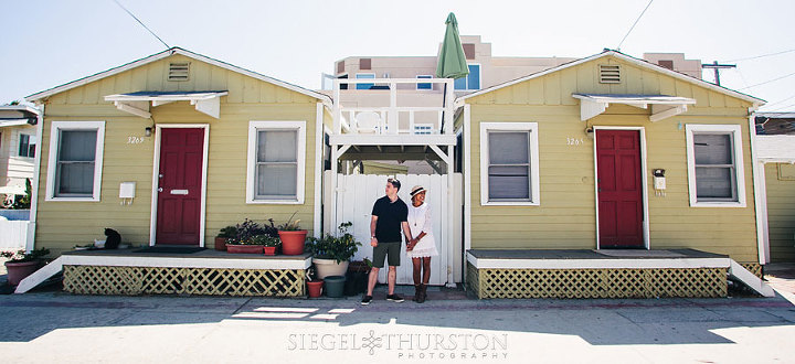 mission beach engagement photos in front of vintage san diego bungalows