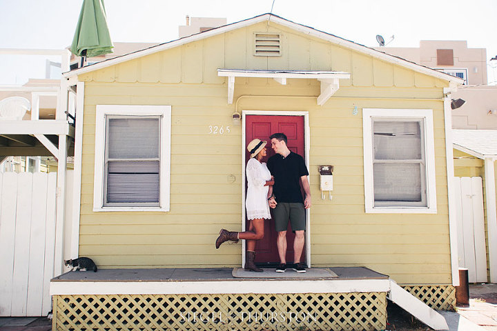 mission beach engagement photos in front of vintage san diego bungalows
