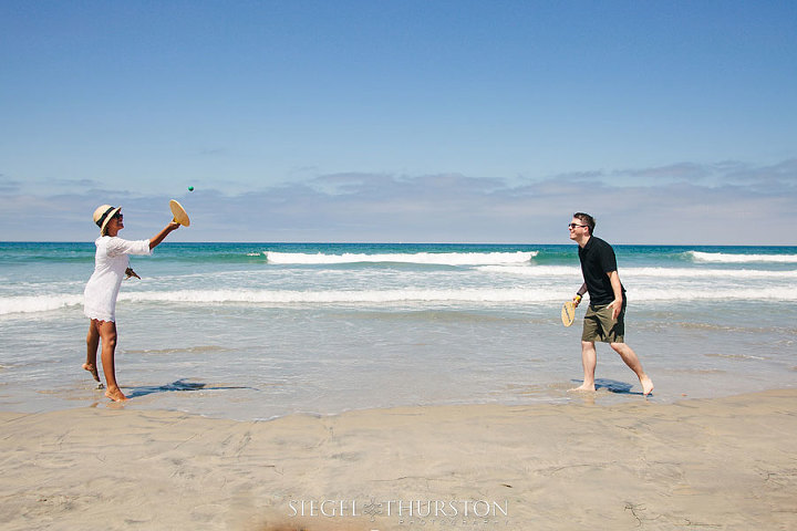 smashball is a prop to bring on your beach engagement shoot.