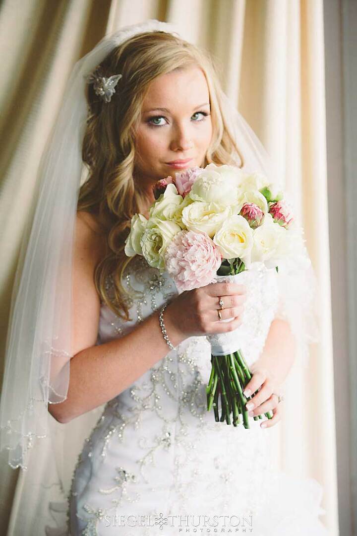 gorgeous bride holding pink and white peonies tucson wedding