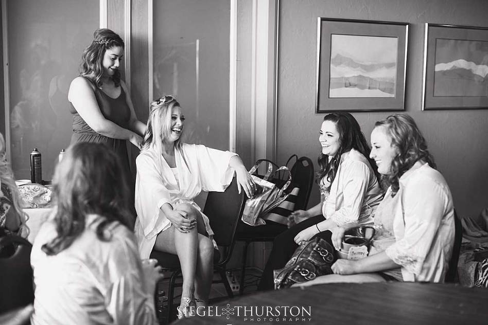 candid moments of the bride getting ready with her girls surrounding her