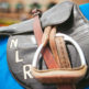 horse racing saddle used as a prop on our styled engagement shoot