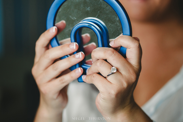 bride looking at herself in the mirror