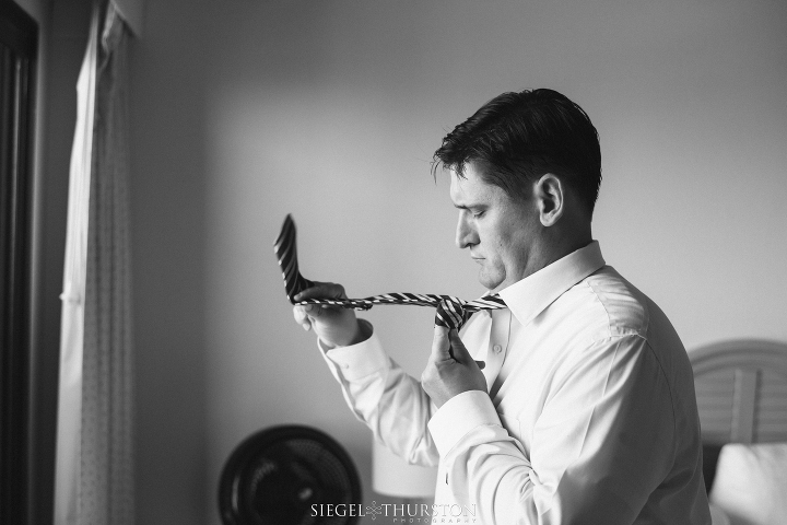 groom getting ready at the la jolla cove suites in san diego