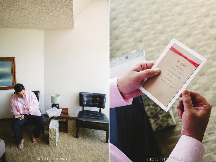 groom reading a card from his bride before their wedding in his suite at La Jolla Cove and Suites Hotel