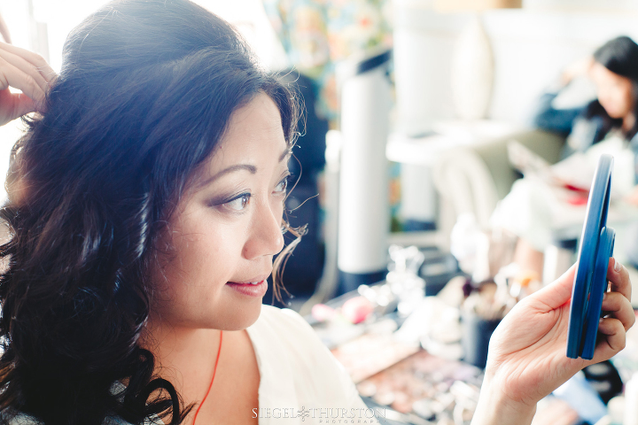 bride looking in the mirror