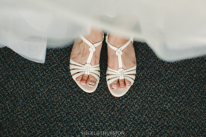 custom painted wedding toe nails with little tuxedos on them.