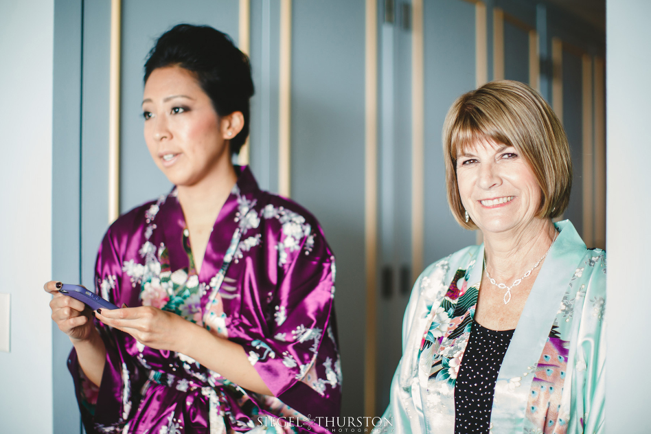 bridesmaids getting ready in kimonos 