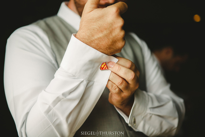 groom wearing super hero cufflinks