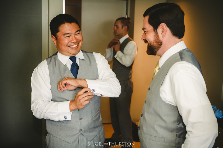 natural moments of the groom and his groomsmen getting ready before the wedding ceremony in san diego