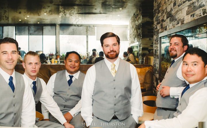 fun groomsmen photos at the bar before the wedding ceremony san diego