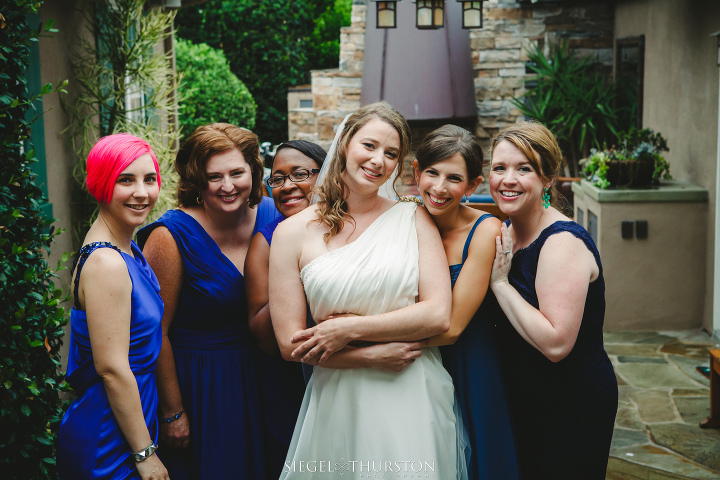 cute shot of all the bridesmaids wearing navy blue dresses