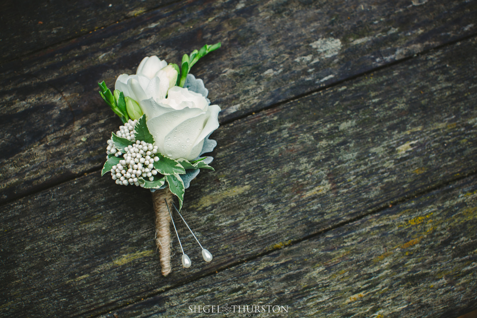 grooms white rose boutonniere with twine