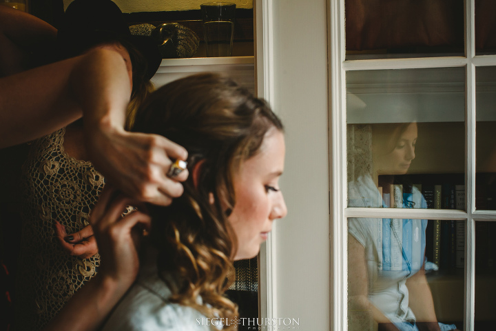 reflection of bride as she is getting ready for her la jolla wedding ceremony