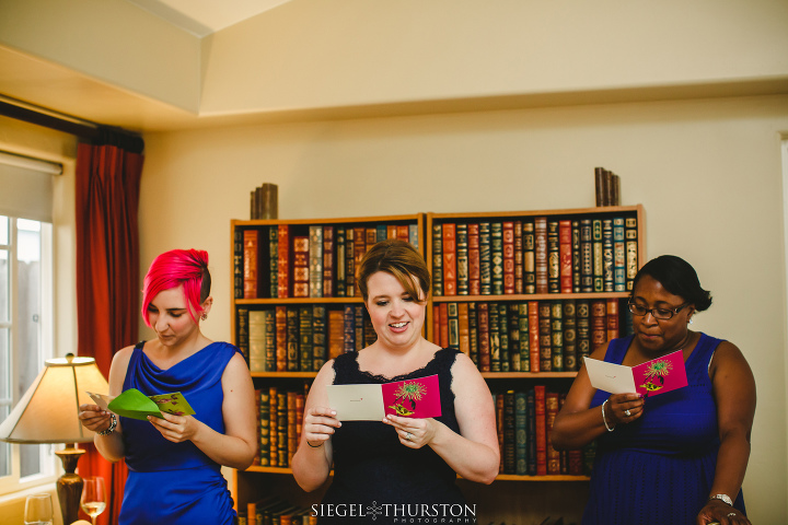 bridesmaids reading letters from the bride on her wedding day