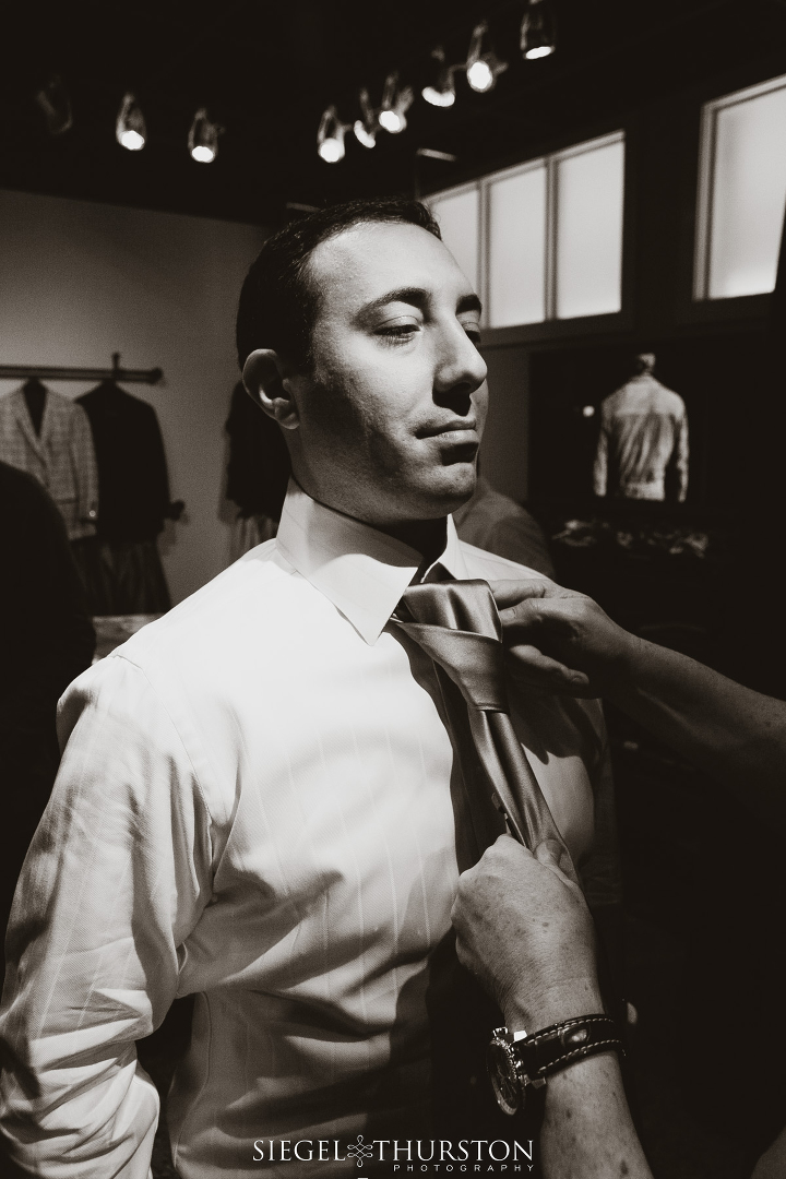 Dallas wedding groom and his groomsmen getting ready at the tailor