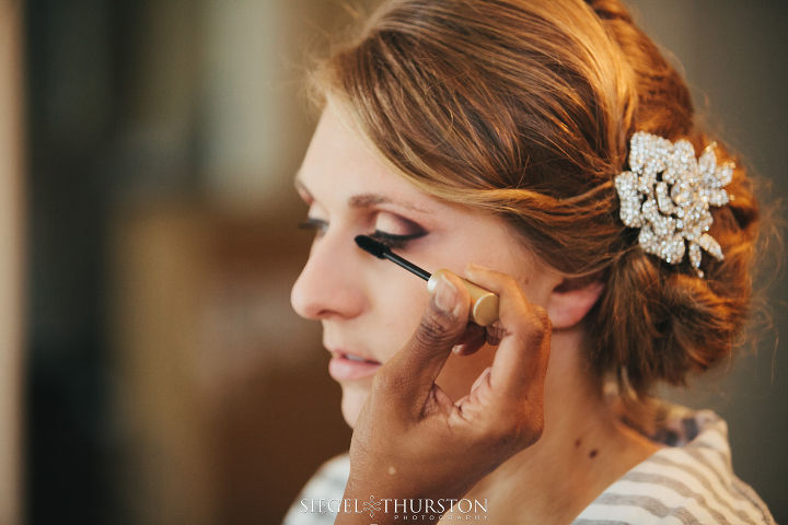 bride getting her make up done for her texas wedding