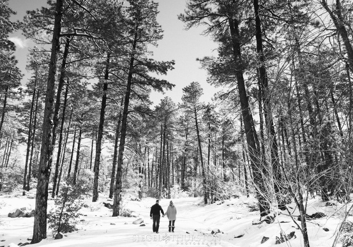 prescott winter engagement shoot couple walking in the trees