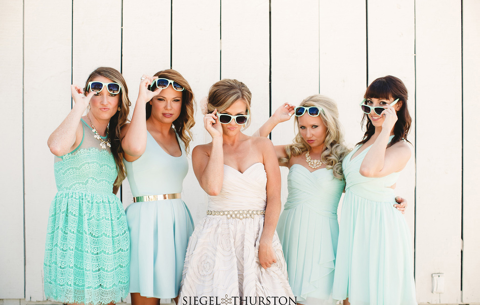 fun bride and bridesmaid portraits wearing ray ban sunglasses